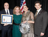 U.S. Rep. Debbie Wasserman Schultz (second from left) and Miguel Olivares (far right) congratulate the Colangelos.