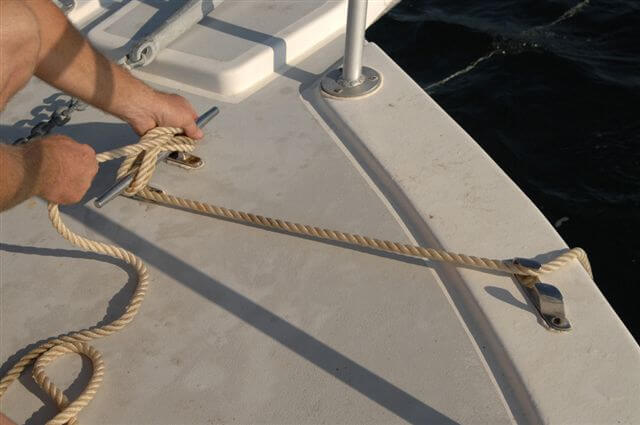 Tying the bow-line to the bow cleat