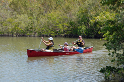family canoeing at West Lake Park