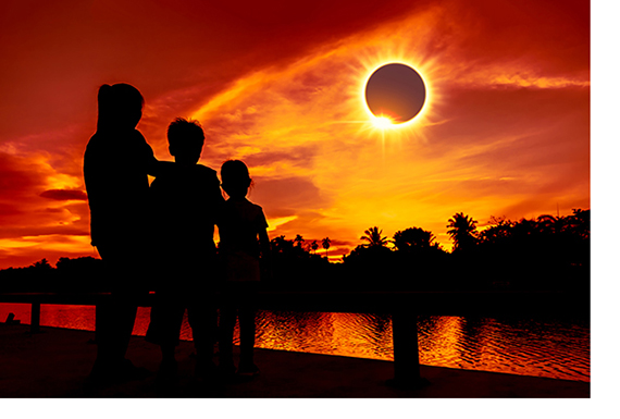 family watching solar eclipse