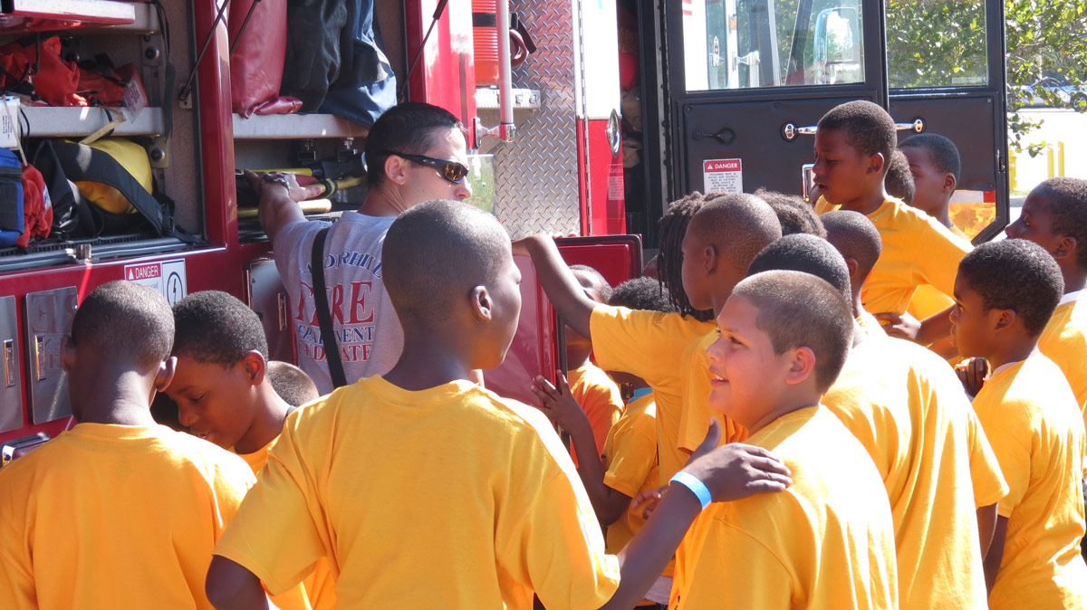 Kids around a fire truck