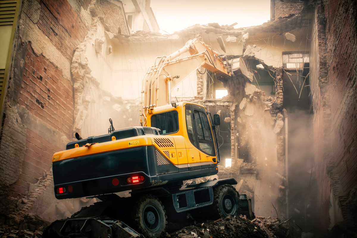 Bobcat demolishing a building