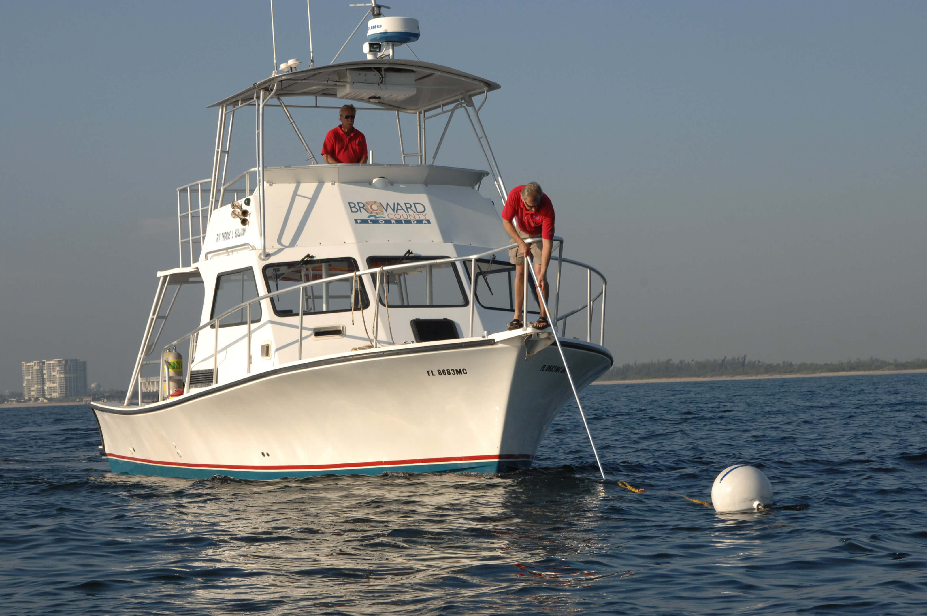 How to retrieve the pick-up line with a boat hook